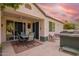 Outdoor patio features dining and seating areas, outdoor kitchen, and lovely sunset views at 7031 S 32Nd Pl, Phoenix, AZ 85042