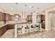 Spacious kitchen featuring a large island with seating, stainless steel appliances, and ample cabinetry at 7242 W Rowel Rd, Peoria, AZ 85383