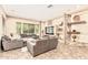 Comfortable living room with stone fireplace and large window at 7242 W Rowel Rd, Peoria, AZ 85383