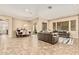 Open-concept living room and dining area with tile flooring at 7242 W Rowel Rd, Peoria, AZ 85383