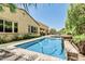 Beautiful pool view with a sleek design, surrounded by desert landscaping, offering a private oasis at 7242 W Rowel Rd, Peoria, AZ 85383