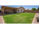 A beautiful backyard with green grass and a covered patio at 764 E Shannon St, Chandler, AZ 85225