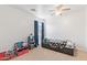 Bright bedroom with ceiling fan, dark wood bed, and blue curtains at 764 E Shannon St, Chandler, AZ 85225