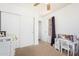 Bedroom featuring a closet, desk, ceiling fan, and a window at 764 E Shannon St, Chandler, AZ 85225