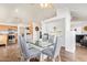 Dining room features an open floorplan, modern table and access to the kitchen and living areas at 764 E Shannon St, Chandler, AZ 85225