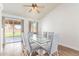 Bright dining room showcases natural light, a modern glass table, and access to the backyard at 764 E Shannon St, Chandler, AZ 85225