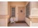 Inviting front porch with a cozy seating area, a decorative door, and a welcome mat at 764 E Shannon St, Chandler, AZ 85225