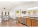 Inviting kitchen and dining area with granite countertops, stainless appliances, and ample natural light at 764 E Shannon St, Chandler, AZ 85225