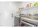 Laundry room featuring stainless steel washer and dryer with shelf at 764 E Shannon St, Chandler, AZ 85225