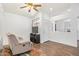 Cozy living room featuring wood flooring, a comfortable recliner, and lots of natural light at 764 E Shannon St, Chandler, AZ 85225