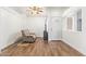 Cozy living room featuring wood flooring, a comfortable recliner, and lots of natural light at 764 E Shannon St, Chandler, AZ 85225