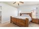 Comfortable main bedroom features a wooden bed frame, carpeted floors, and an airy atmosphere at 764 E Shannon St, Chandler, AZ 85225