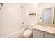Bathroom with shower over tub, granite countertops, neutral walls, and tiled backsplash at 8055 W Sanna St, Peoria, AZ 85345