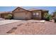 Charming single-story home with a well-maintained yard, desert landscaping, and a two-car garage at 8055 W Sanna St, Peoria, AZ 85345