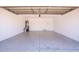 Spacious two car garage with gray epoxy floors and access door at 8055 W Sanna St, Peoria, AZ 85345