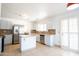 Modern kitchen featuring stainless appliances, granite countertops, and an island, perfect for cooking at 8055 W Sanna St, Peoria, AZ 85345