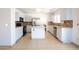 Kitchen with island, tile backsplash, and white cabinets, plenty of space to prep and cook at 8055 W Sanna St, Peoria, AZ 85345