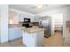 Functional kitchen with island, sleek appliances, and tiled backsplash, open to other living areas at 8055 W Sanna St, Peoria, AZ 85345