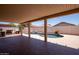 Covered patio overlooking a pool with decorative rock waterfall at 8055 W Sanna St, Peoria, AZ 85345