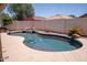 Backyard swimming pool featuring a stone waterfall and mature landscaping, ideal for outdoor enjoyment at 8055 W Sanna St, Peoria, AZ 85345
