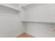 Walk-in closet includes wood floors and white walls with metal racking at 8256 W Bloomfield Rd, Peoria, AZ 85381