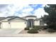 Charming single-story home with a three-car garage and well-manicured front yard landscaping at 8256 W Bloomfield Rd, Peoria, AZ 85381