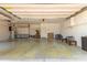 Spacious garage includes epoxy floors and storage cabinets along the back wall at 8256 W Bloomfield Rd, Peoria, AZ 85381