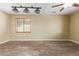 Large living room featuring neutral walls, decorative lights, and stylish flooring at 8256 W Bloomfield Rd, Peoria, AZ 85381