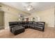 Inviting living room featuring hardwood floors and a large sectional sofa at 8256 W Bloomfield Rd, Peoria, AZ 85381