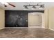 Spacious living room with decorative accent wall and seamless flow to adjacent spaces at 8256 W Bloomfield Rd, Peoria, AZ 85381