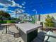 Outdoor patio with modern fire table, seating area and Scottsdale mural under string lights at 8750 E Starlight Way, Scottsdale, AZ 85250