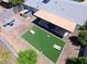 Enjoy the backyard's private patio, hot tub, and expansive artificial grass area with yard games at 8750 E Starlight Way, Scottsdale, AZ 85250