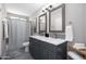 Stylish bathroom with a double vanity, framed mirrors, and modern fixtures at 8750 E Starlight Way, Scottsdale, AZ 85250