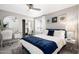 Bright bedroom featuring a bed, desk and large mirror at 8750 E Starlight Way, Scottsdale, AZ 85250