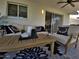 Well-appointed covered patio with ceiling fan and outdoor seating, perfect for relaxation at 8750 E Starlight Way, Scottsdale, AZ 85250
