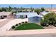Charming single-story home featuring a well-manicured front yard with mature landscaping at 8750 E Starlight Way, Scottsdale, AZ 85250