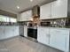 Modern kitchen with stainless steel appliances and sleek white cabinetry at 8750 E Starlight Way, Scottsdale, AZ 85250
