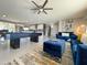 Living room with pool table, blue sofas, and modern decor creates a comfortable and stylish space at 8750 E Starlight Way, Scottsdale, AZ 85250
