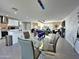 Open floor plan with dining area, kitchen, living room, and a striking blue pool table at 8750 E Starlight Way, Scottsdale, AZ 85250
