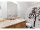 Clean bathroom featuring a neutral color scheme, single sink vanity, toilet, and shower with decorative curtain at 8832 E Pueblo Ave # 71, Mesa, AZ 85208
