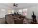 Inviting living room featuring a comfortable brown sectional sofa and natural light from the windows at 8832 E Pueblo Ave # 71, Mesa, AZ 85208