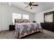 Comfortable bedroom with a vaulted ceiling, plush carpet, and a stylish quilt-covered bed at 8832 E Pueblo Ave # 71, Mesa, AZ 85208