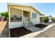 Charming porch with shade screens, steps to entryway, and mulched landscaping at 8832 E Pueblo Ave # 71, Mesa, AZ 85208