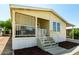 Inviting porch with screened walls and steps leading to the home's entryway at 8832 E Pueblo Ave # 71, Mesa, AZ 85208