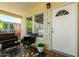 Comfortable outdoor porch featuring seating and charming floral accents near the front door at 8832 E Pueblo Ave # 71, Mesa, AZ 85208