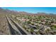 Picture of a neighborhood featuring single Gathering homes, sidewalks, desert landscaping, and gorgeous mountain views at 10253 E Indigo Dr, Scottsdale, AZ 85255
