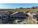 Aerial view of the property highlighting a private pool, outdoor living space, and scenic desert surroundings at 10253 E Indigo Dr, Scottsdale, AZ 85255