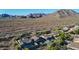 Aerial view of home featuring a private pool, fenced yard, covered patio, and desert landscaping at 10253 E Indigo Dr, Scottsdale, AZ 85255
