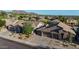 Aerial view of homes in a neighborhood with desert landscaping, tile roofs and spacious lots at 10253 E Indigo Dr, Scottsdale, AZ 85255