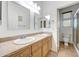 Bright bathroom featuring double sinks and vanities, tile flooring, and a toilet and shower at 10253 E Indigo Dr, Scottsdale, AZ 85255